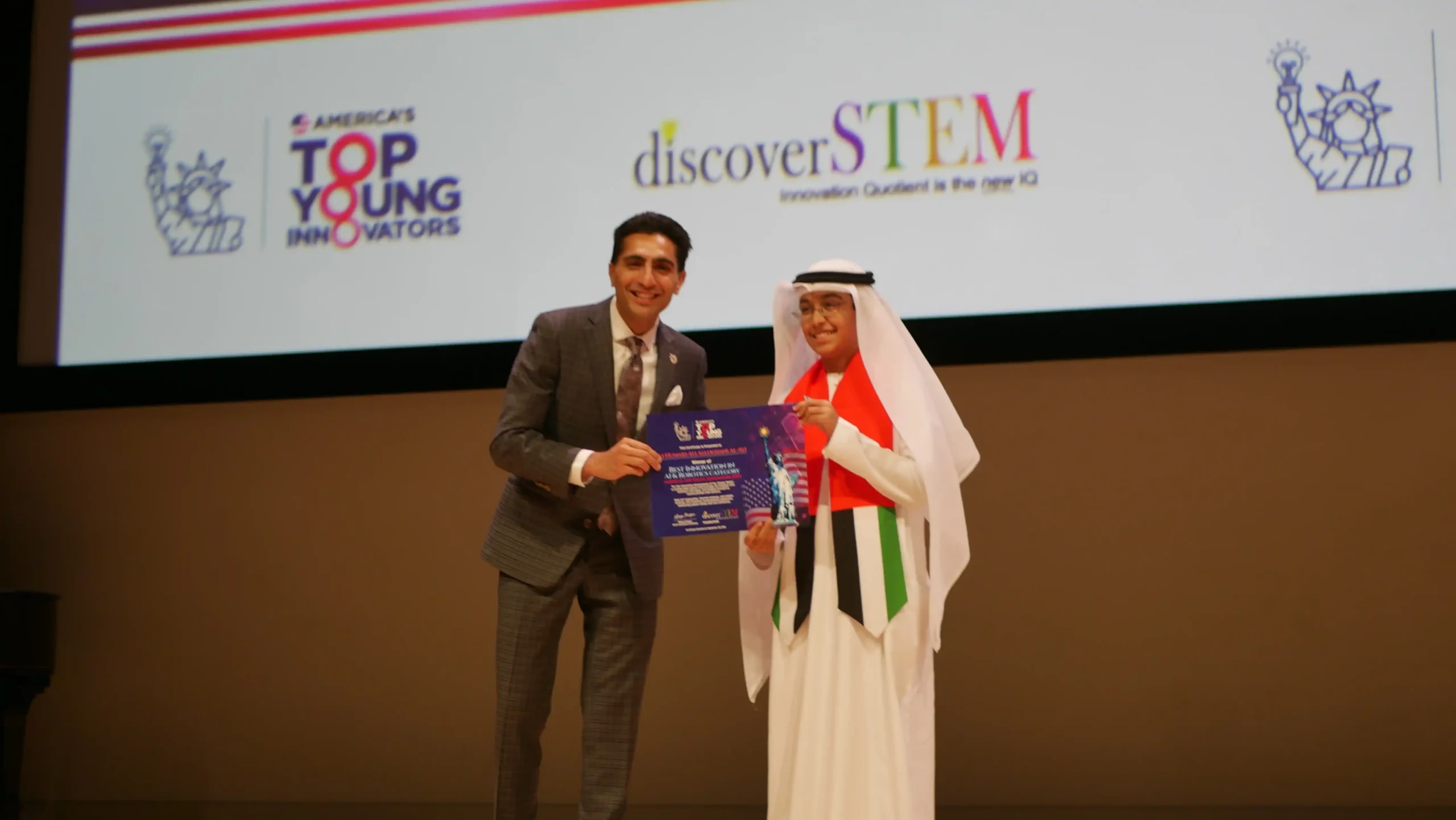 Ali Humaid on stage receiving TYI America Best Innovation Award 2024 in Robotics Category